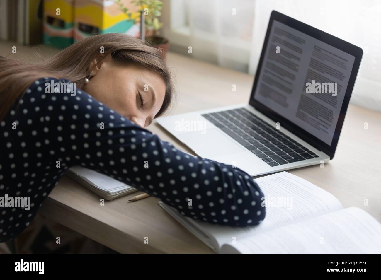 Close up tired young woman falling asleep at work desk stock photo alamy