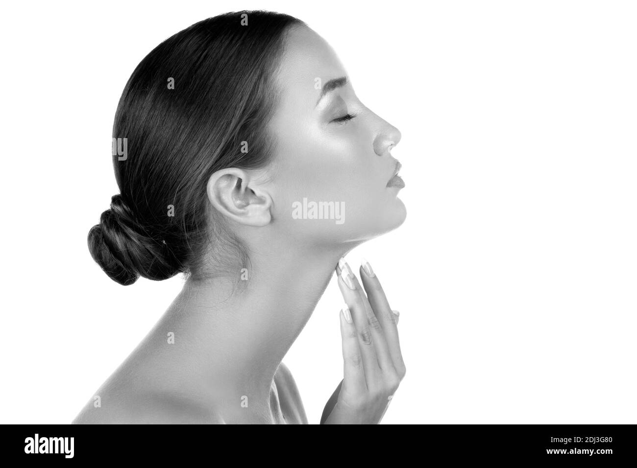 Pretty woman touching her neck, isolated on white background Stock Photo