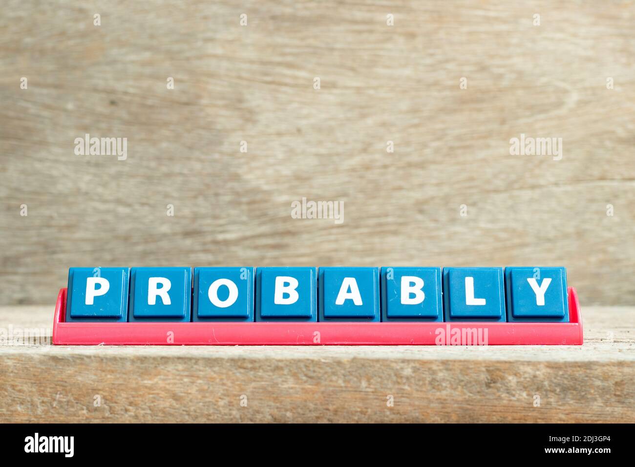 Tile letter on red rack in word probably on wood background Stock Photo