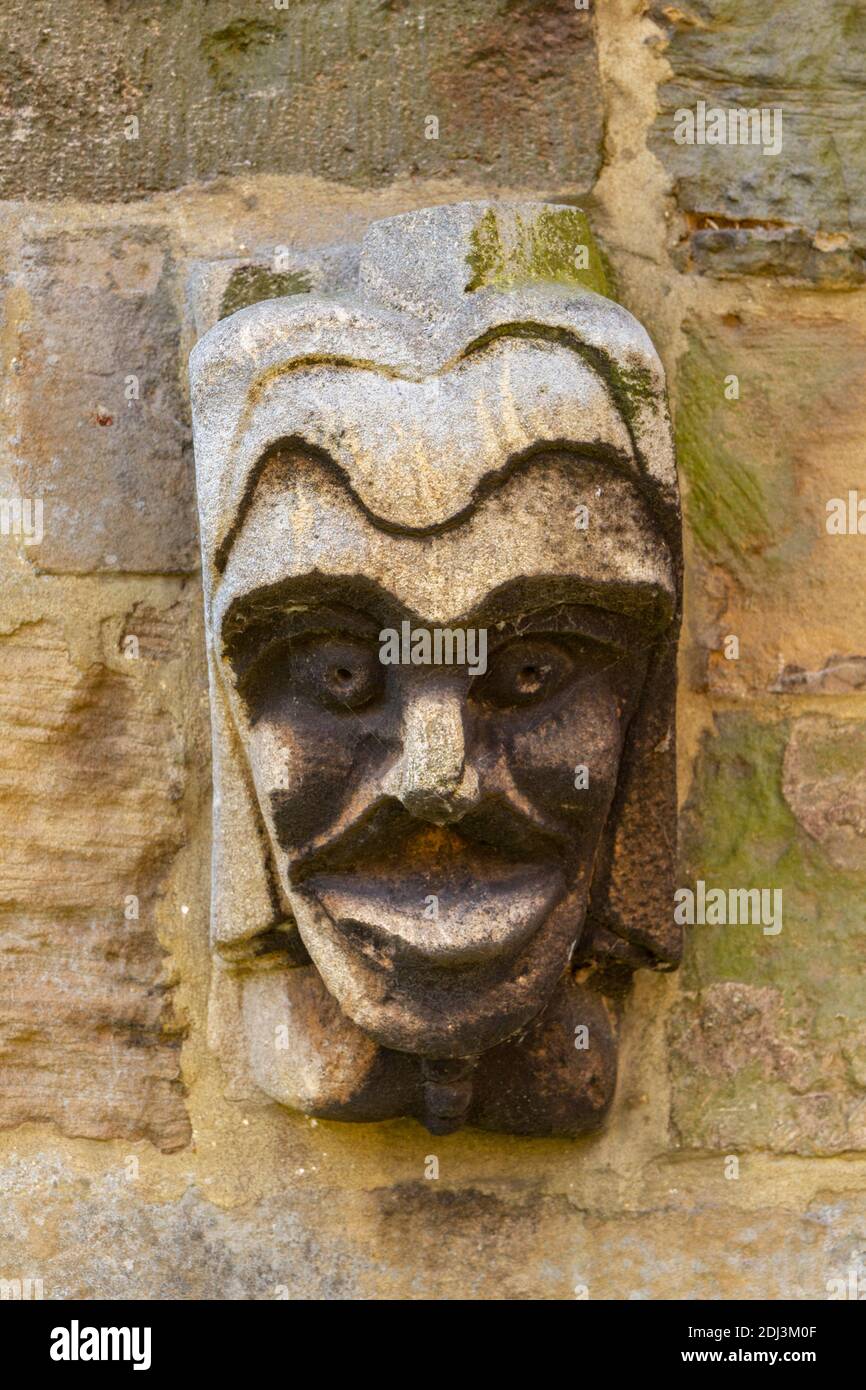 Face on the wall of the Archbishop’s Palace, Southwell Minster, Southwell, Nottinghamshire, UK. Stock Photo
