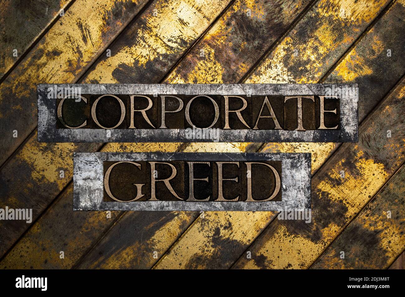 Corporate Greed text on vintage textured silver grunge copper and gold background Stock Photo