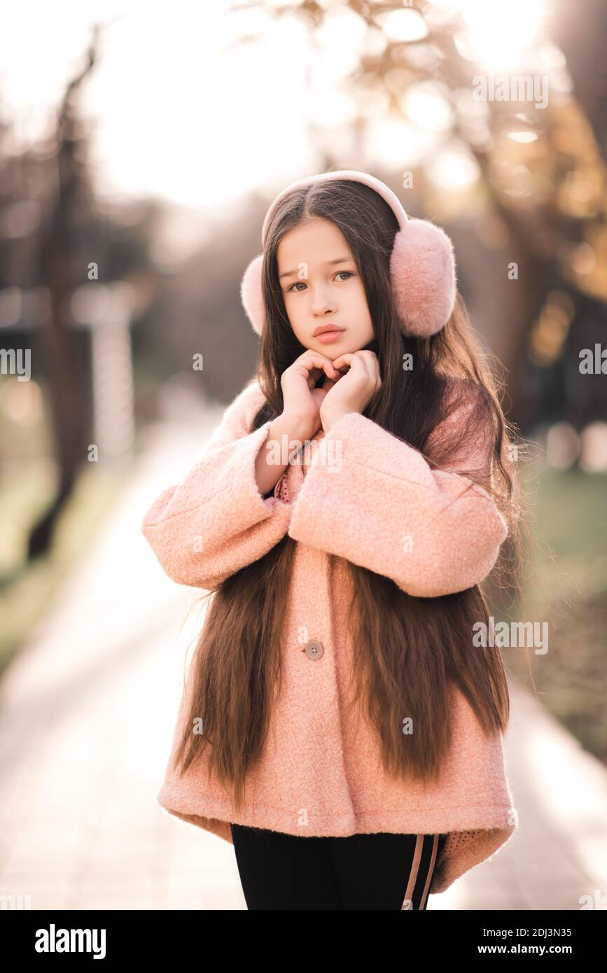 Little girl wearing pink coat hi-res stock photography and images - Alamy
