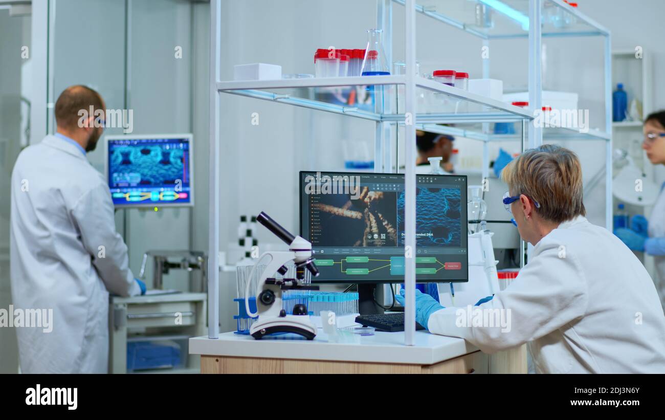 Elderly lab technician making pharmaceutical research for antibiotics