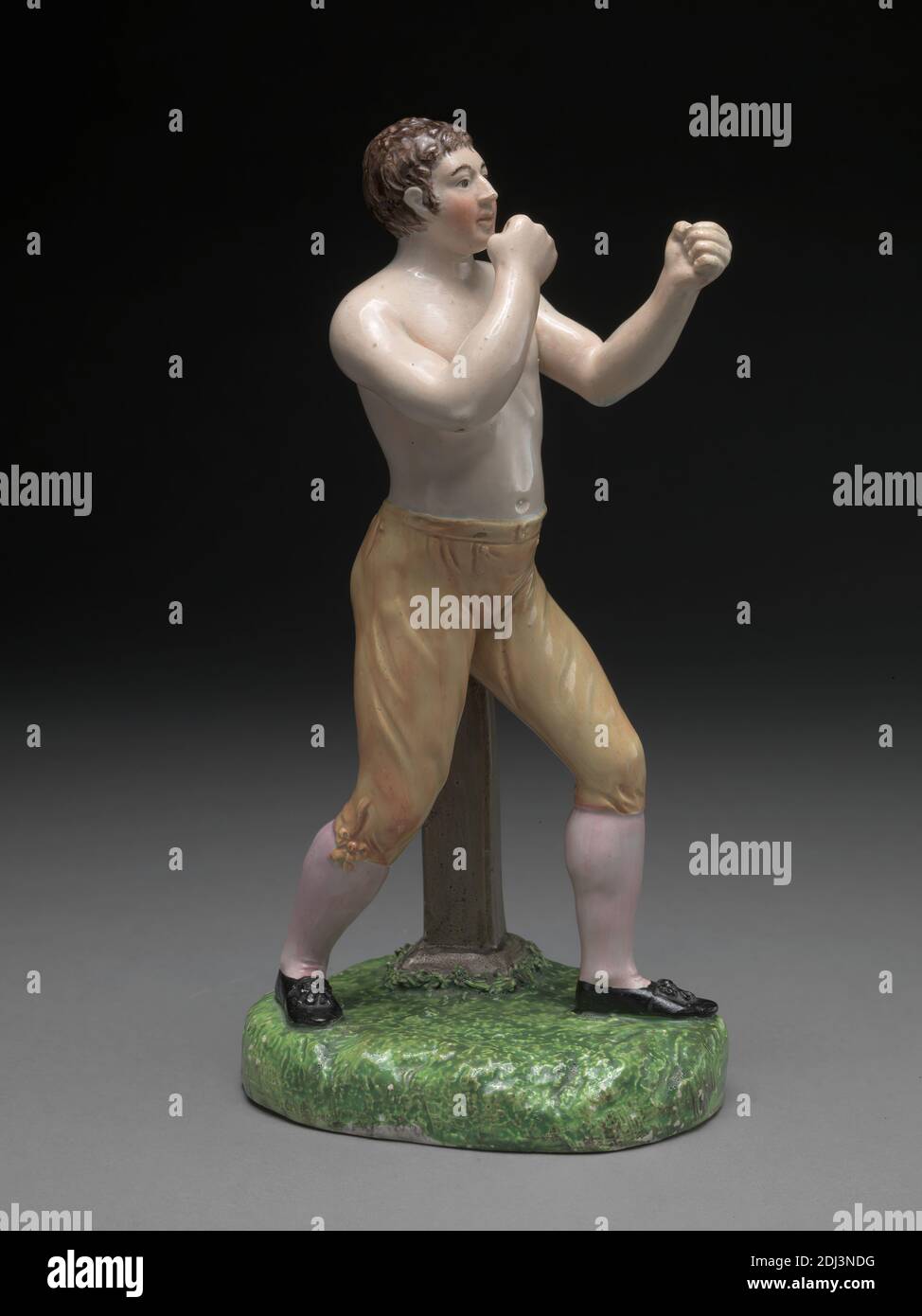 The Boxer Tom Cribb: in canary breeches, Staffordshire pottery, ca. 1800, Staffordshire (Enoch Wood) pearlware figure, Sheet: 9in. (22.9cm), boxer, sporting art Stock Photo
