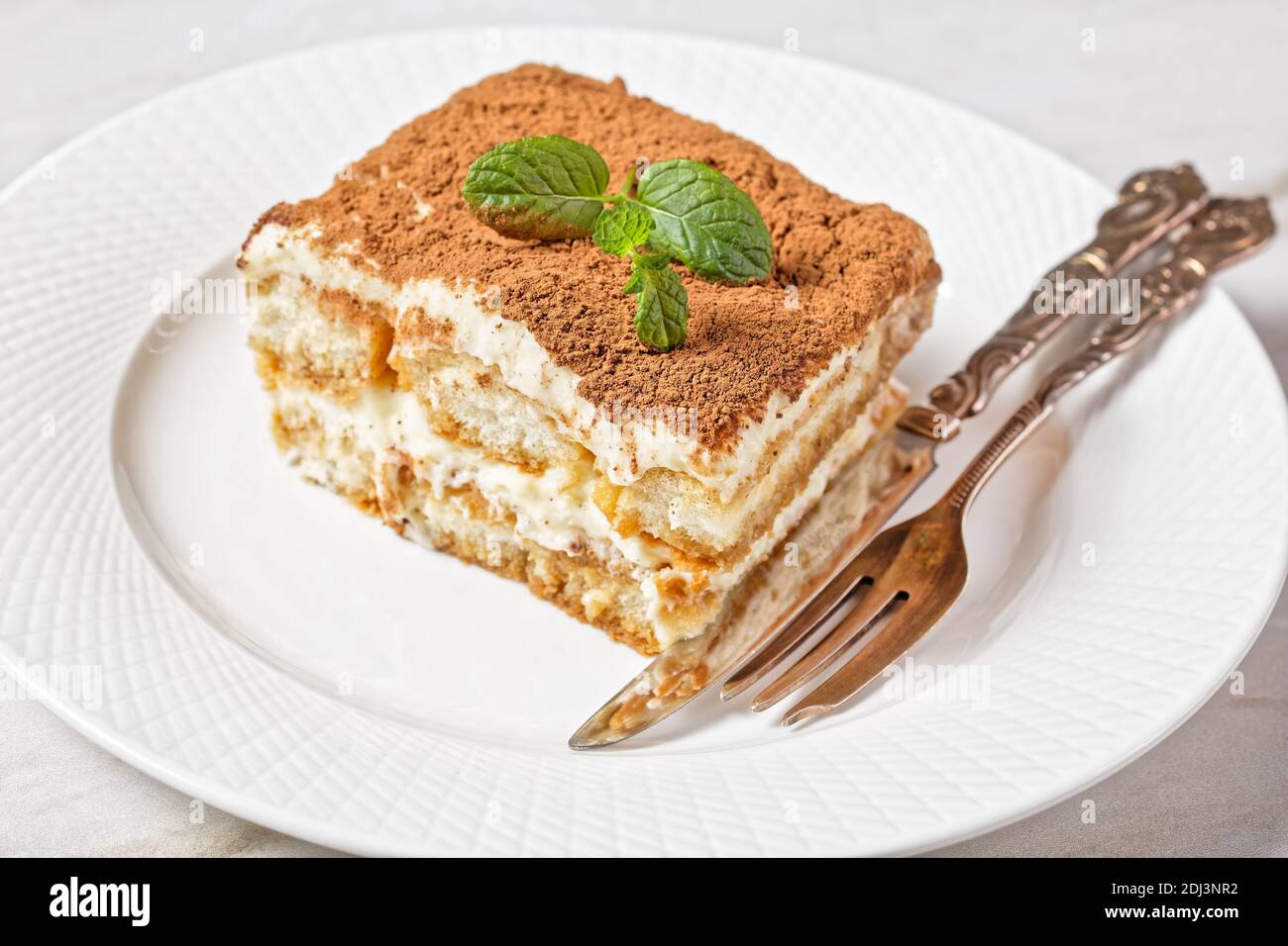 Classic Italian Dessert Tiramisu Of Ladyfingers Or Savoiardi Soaked In Espresso And Mascarpone Mixed With Beaten Egg Whites Served On A White Plate Wi Stock Photo Alamy Classic Italian Dessert Tiramisu Of Ladyfingers Or Savoiardi Soaked In Espresso And Mascarpone Mixed With Beaten Egg Whites Served On A White Plate Wi Stock Photo Alamy