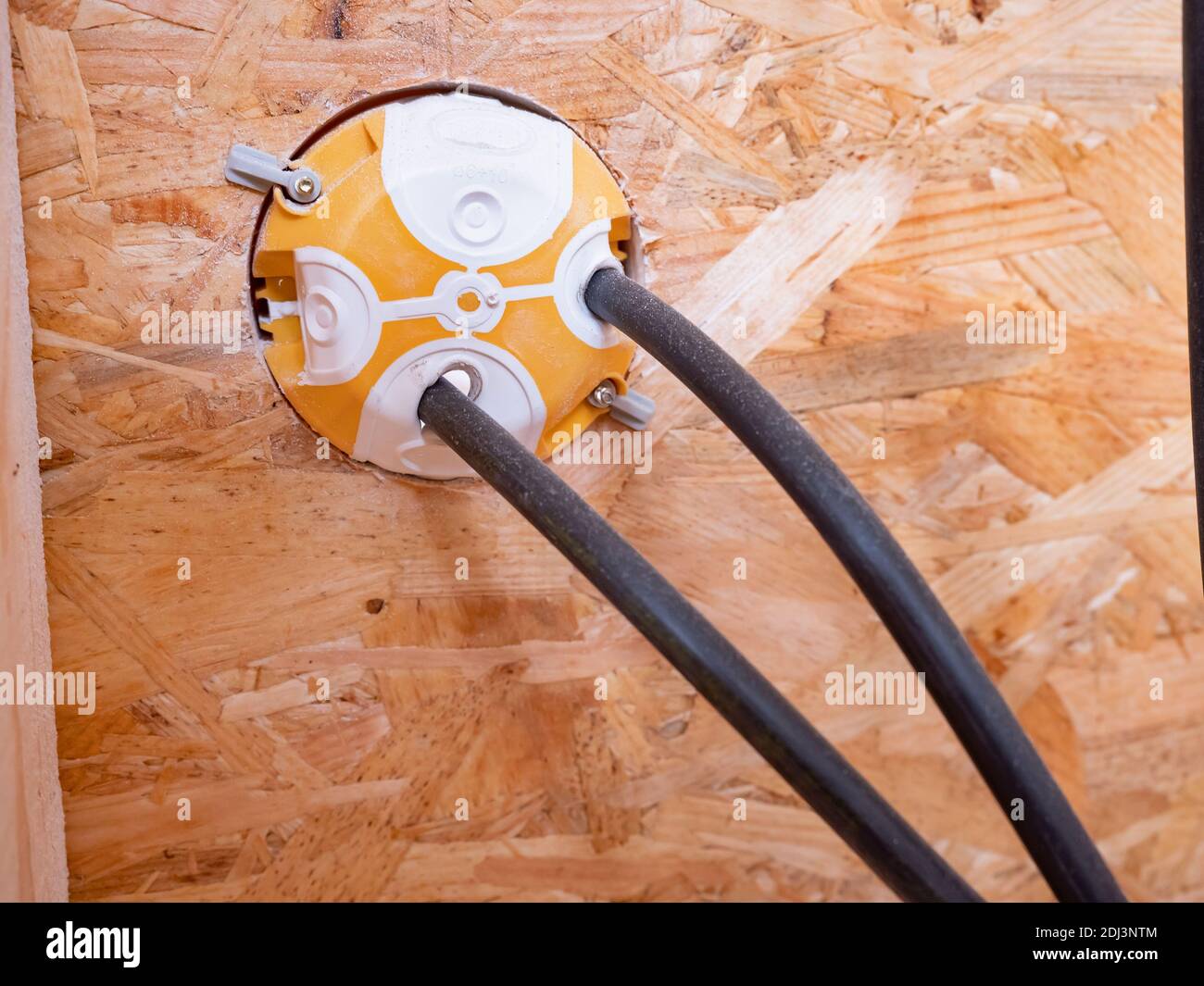 Electrical sockets in a wooden building from the back. Preparation for