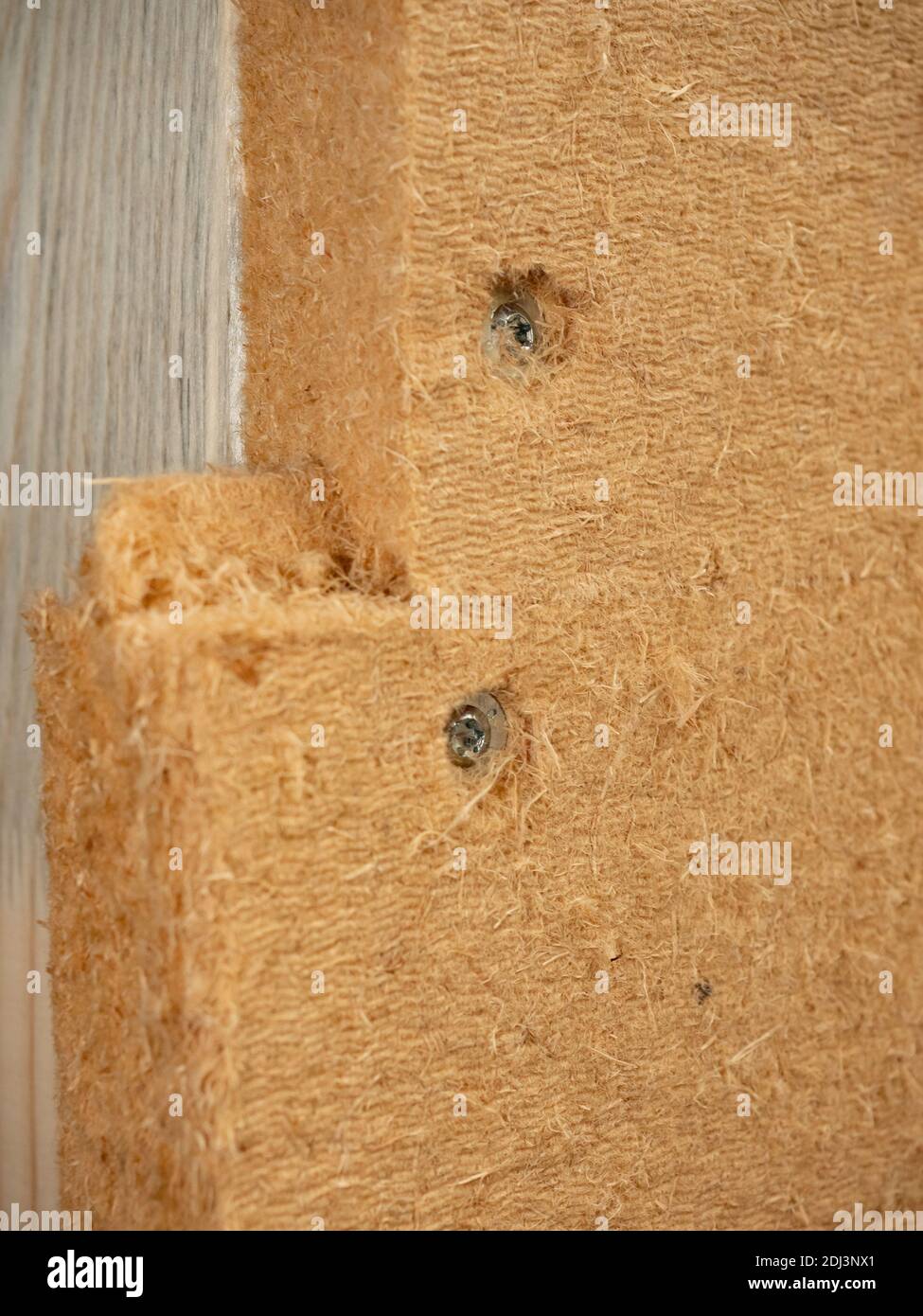 Installation of wooden fibreboard and isolation wool. Warming of floor