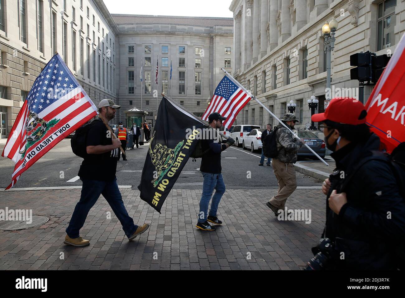 Proud Boys march with flags in Freedom Plaza during the demonstration.Backers continue to support the President’s unproven claims of massive voter fraud and electoral irregularities. Following the November MAGA rally in Washington, Women for America First, a conservative organization, has filed for another permit to rally in support of President Trump, just two days before the electors form each state are to vote for their candidate. Stock Photo