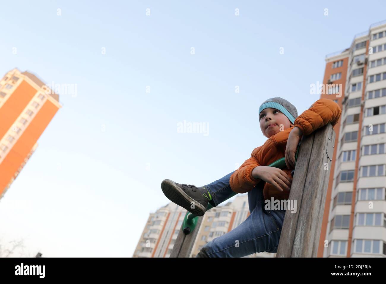Kid on horizontal bar at outdoor playground Stock Photo Alamy