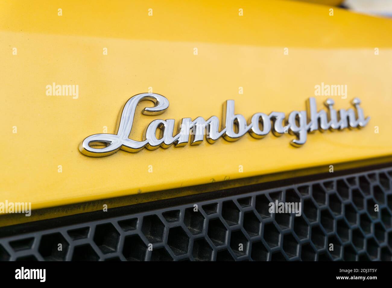 Close up detail of the brand name badge logo on rear of a yellow