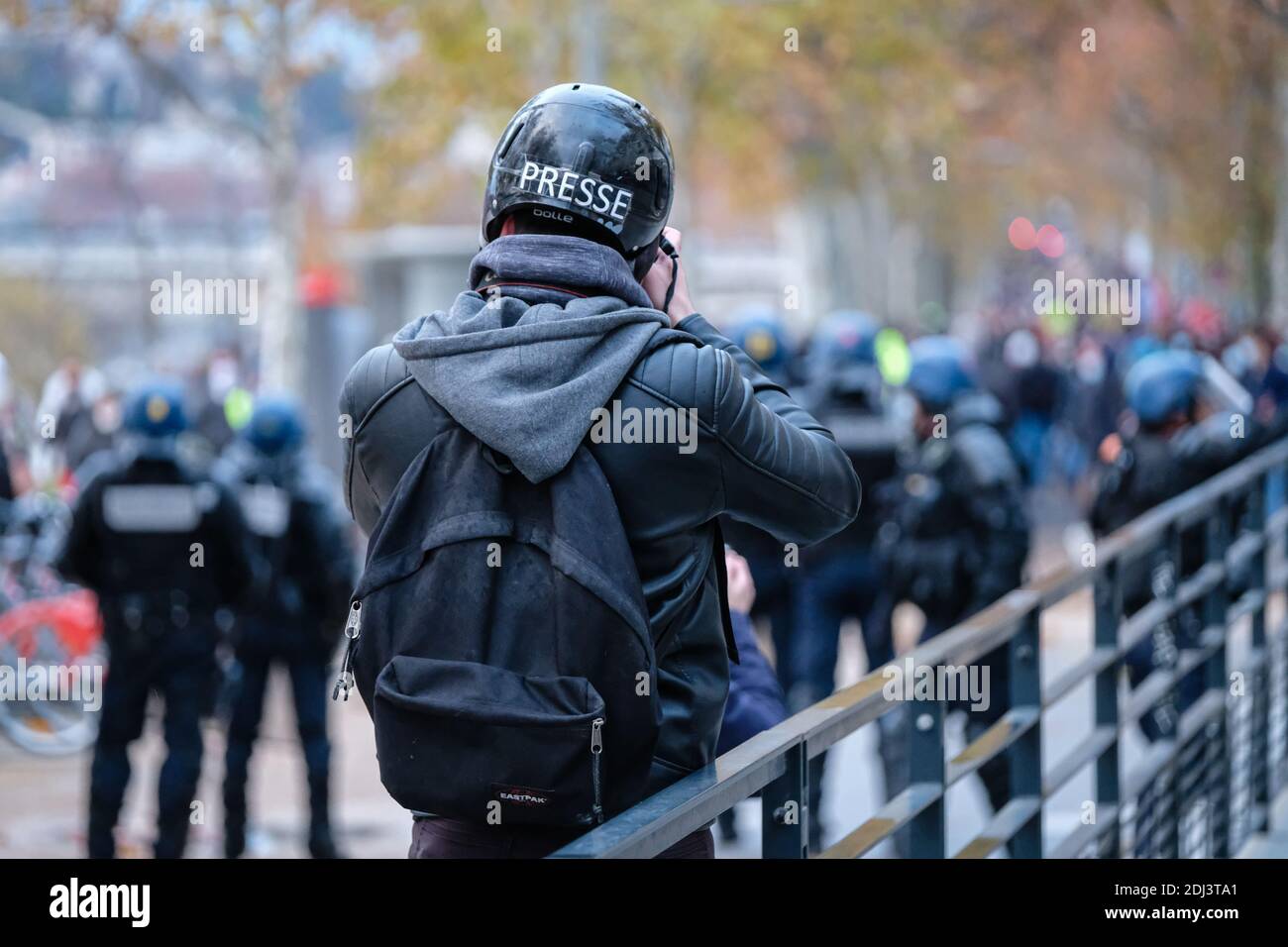 Lyon (France), 12 December 2020. 2000 demonstrators according to the Rhône prefecture for this new pride march in Lyon. Journalist filming the police. Stock Photo