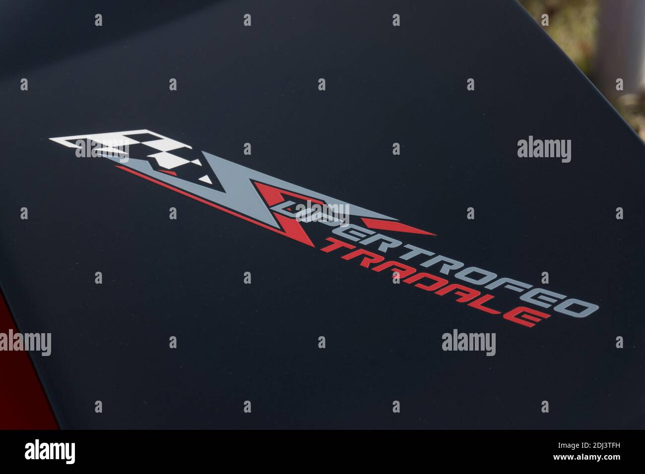 Close up detail of  the model name and number on the carbon wing of a Rosso Mars red Lamborghini Gallardo LP 570-4 Super Trofeo Stradale Stock Photo