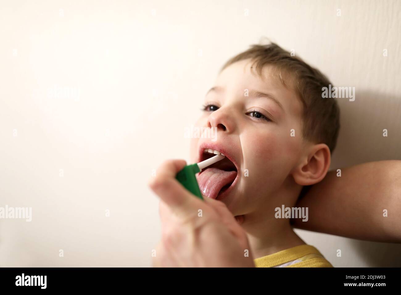 Treatment of a boy cold at home Stock Photo