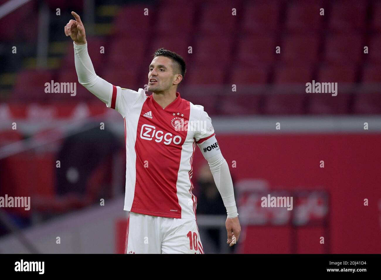 AMSTERDAM, NETHERLANDS - DECEMBER 12: Dusan Tadic of Ajax with OneLove rainbow colors captaincy during the Dutch Eredivisie match between Ajax and PEC Stock Photo