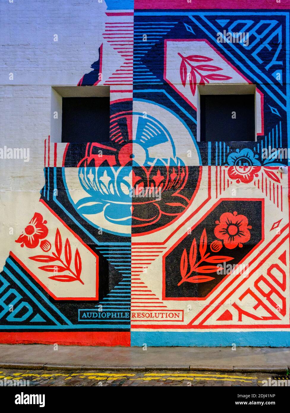 Detail of  graffiti street art by artist Shepard Fairey on the exterior of a building at Whitby Street Shoreditch London, UK Stock Photo