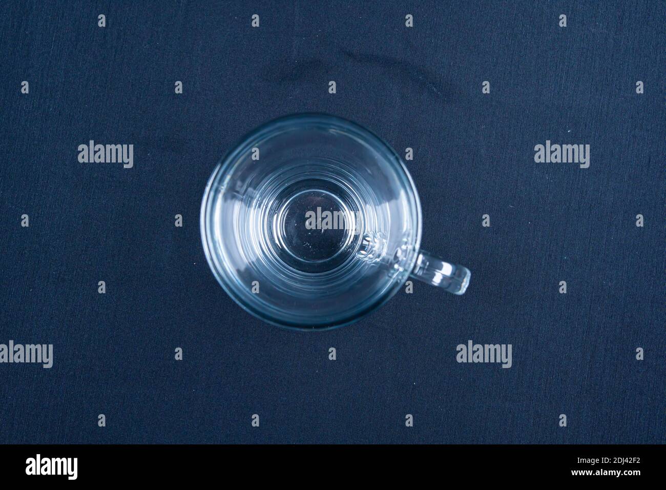 Empty glass on black background with mirroring Stock Photo