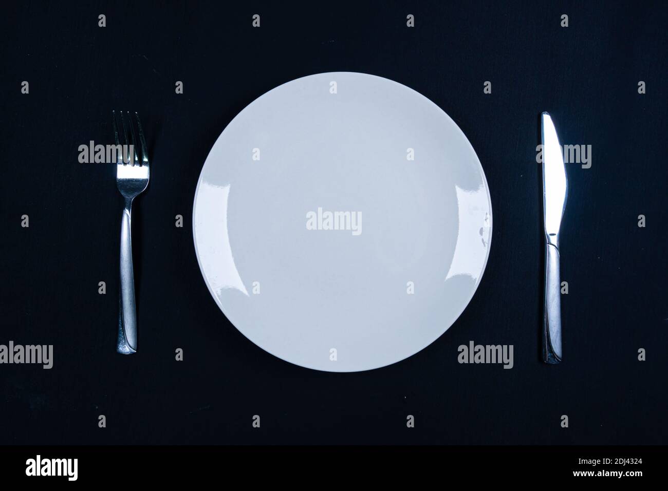 Dinner service on the black background Stock Photo