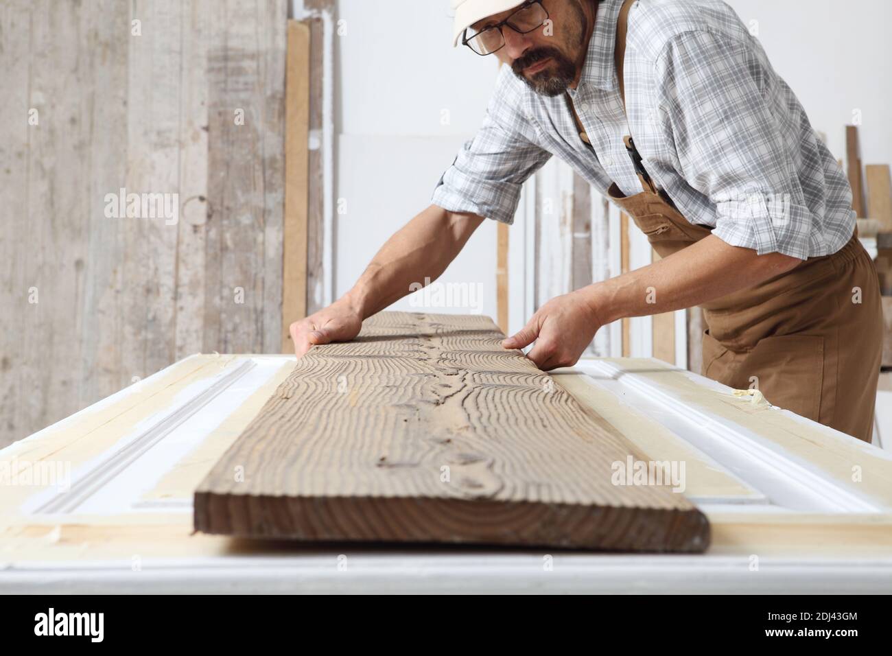 Carpenter holding wooden door hires stock photography and images Alamy