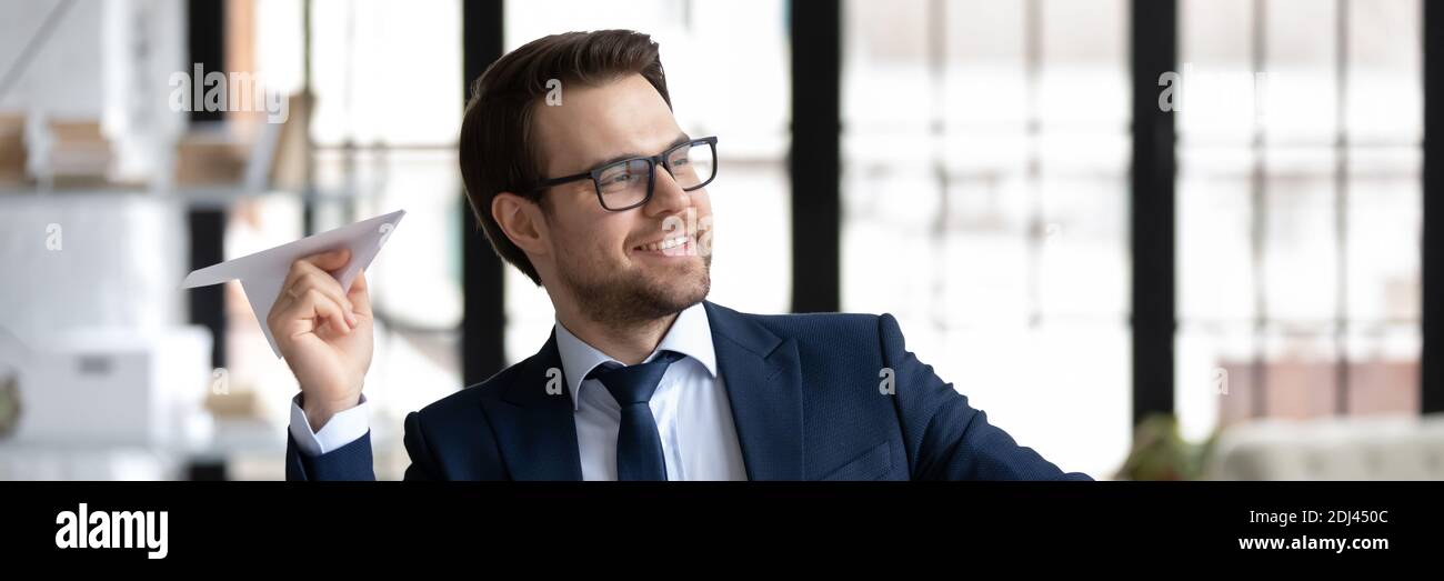 Horizontal banner happy businessman having fun with paper plane Stock Photo