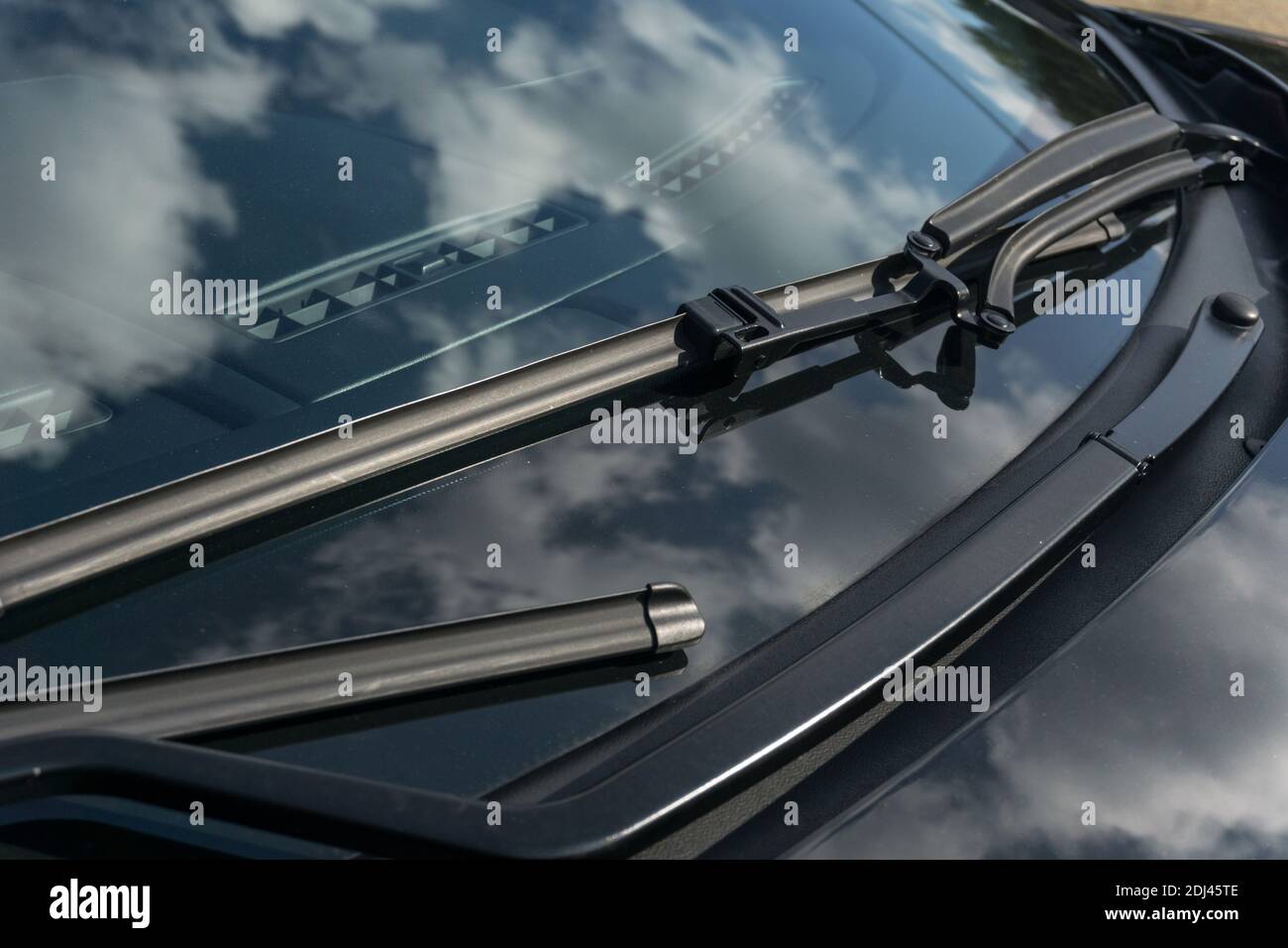Close up detail of the windscreen wipers and on a metallic black