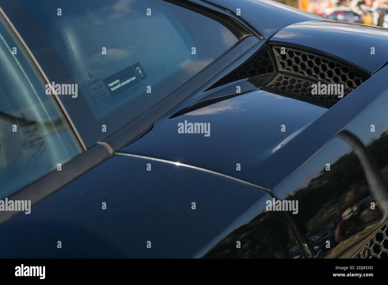 Close up detail of the rear left air intake duct and side window on a