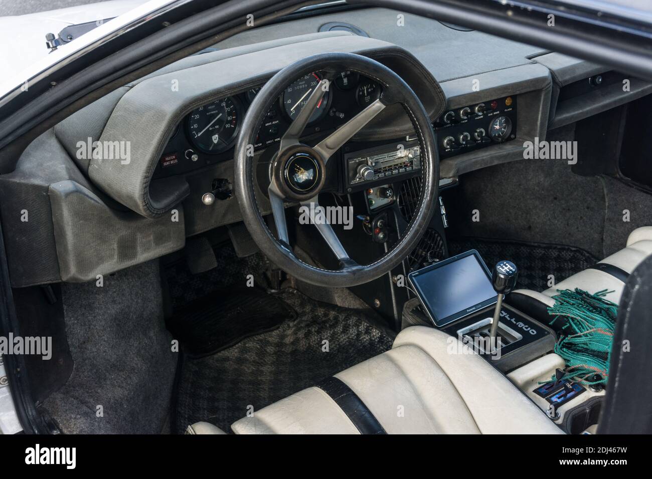 Close up detail of the dark grey interior, dashboard and steering wheel of  a Lamborghini Silhouette P300 Stock Photo - Alamy