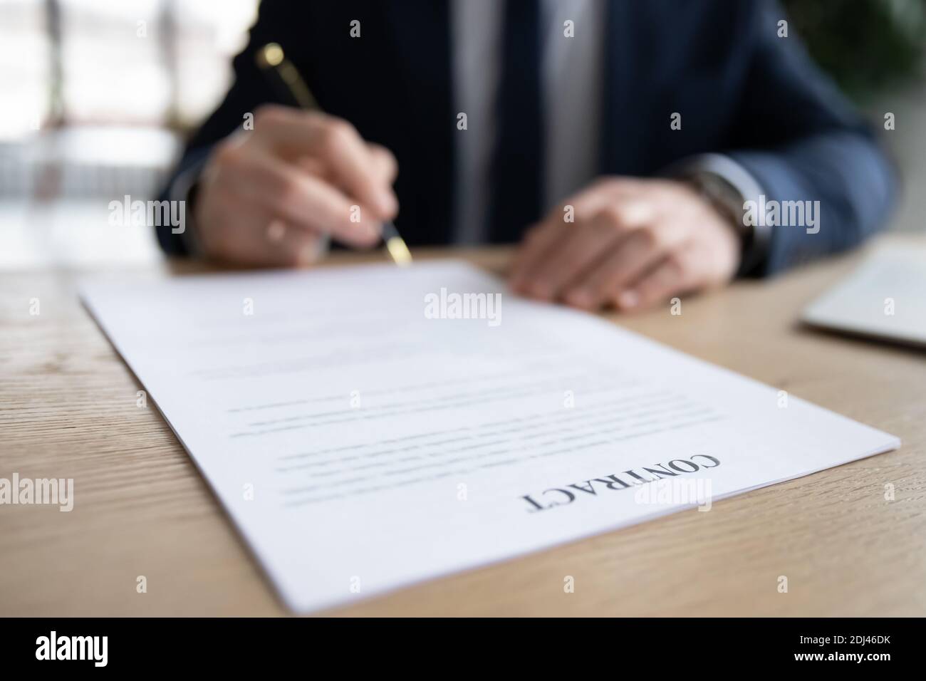 Close up businessman signing contract, putting signature on legal ...