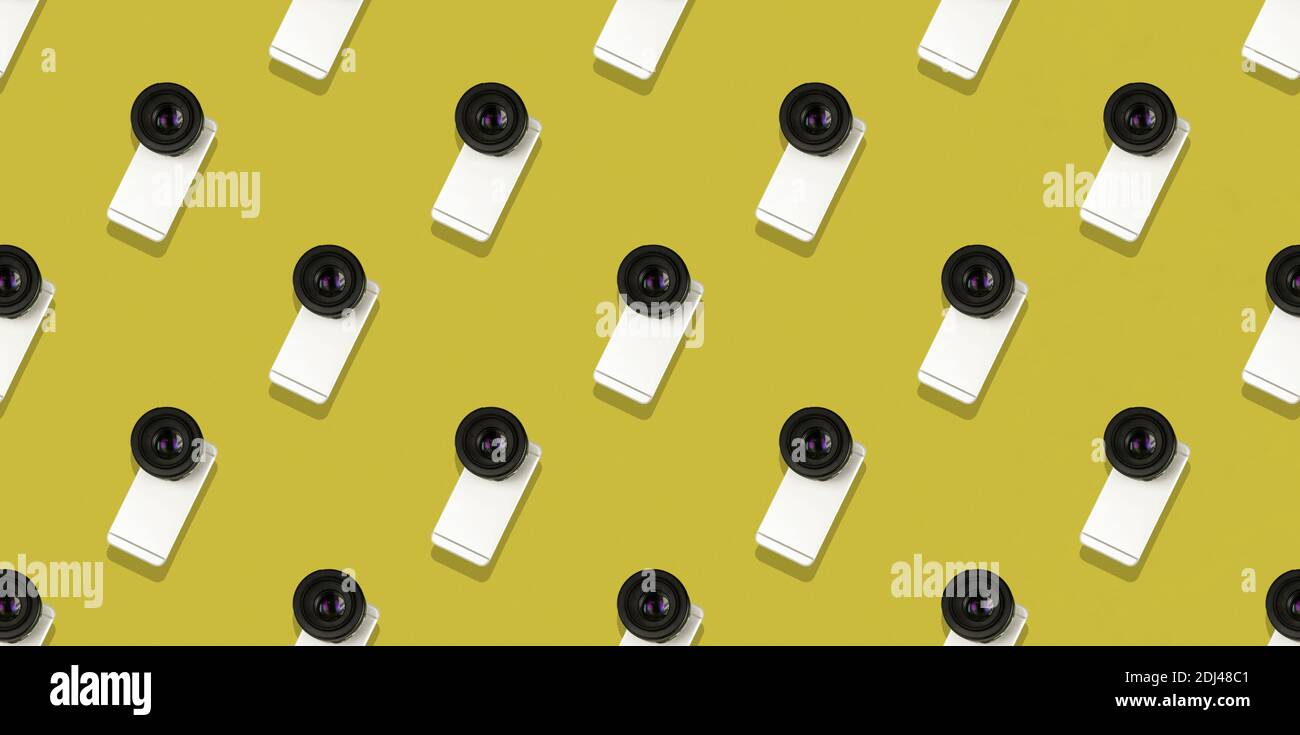 Seamless flat pattern, smartphone with a big camera from a DSLR, minimal concept, banner, gold background photo Stock Photo