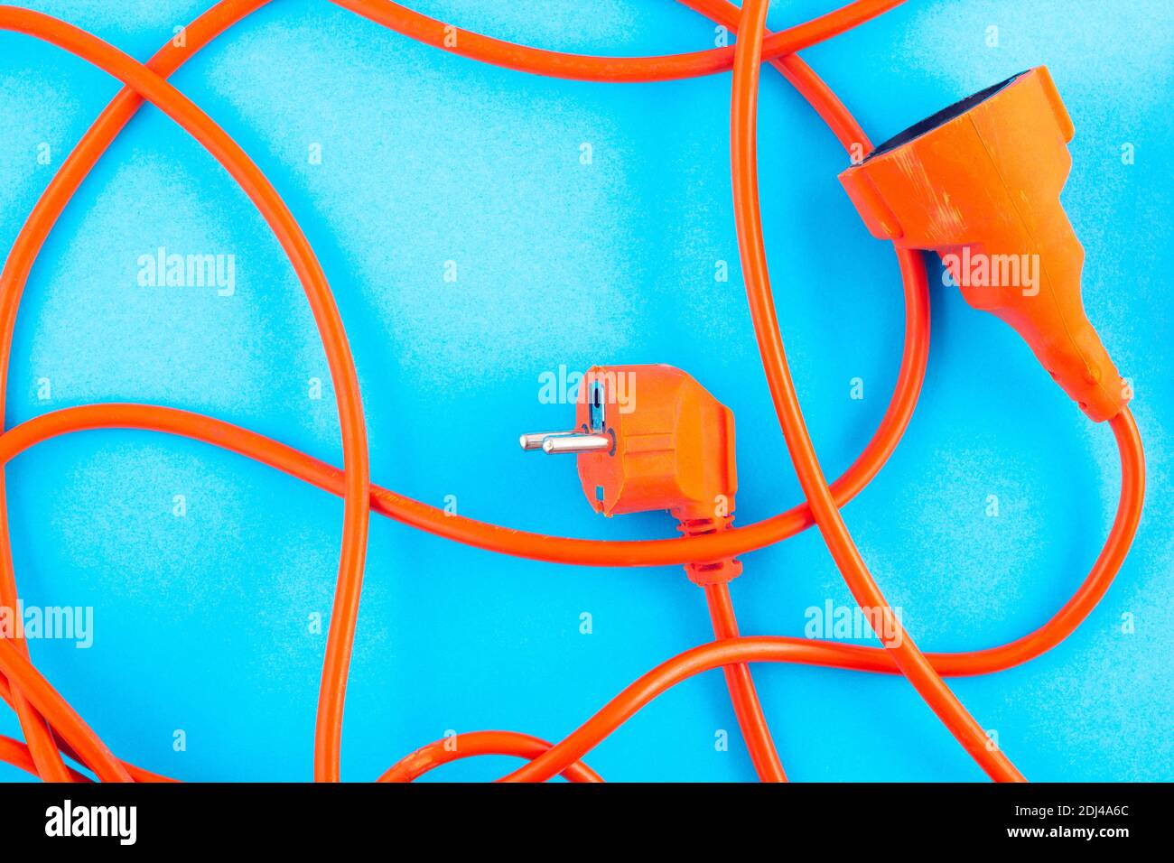 Orange electrical wire on blue background Stock Photo Alamy