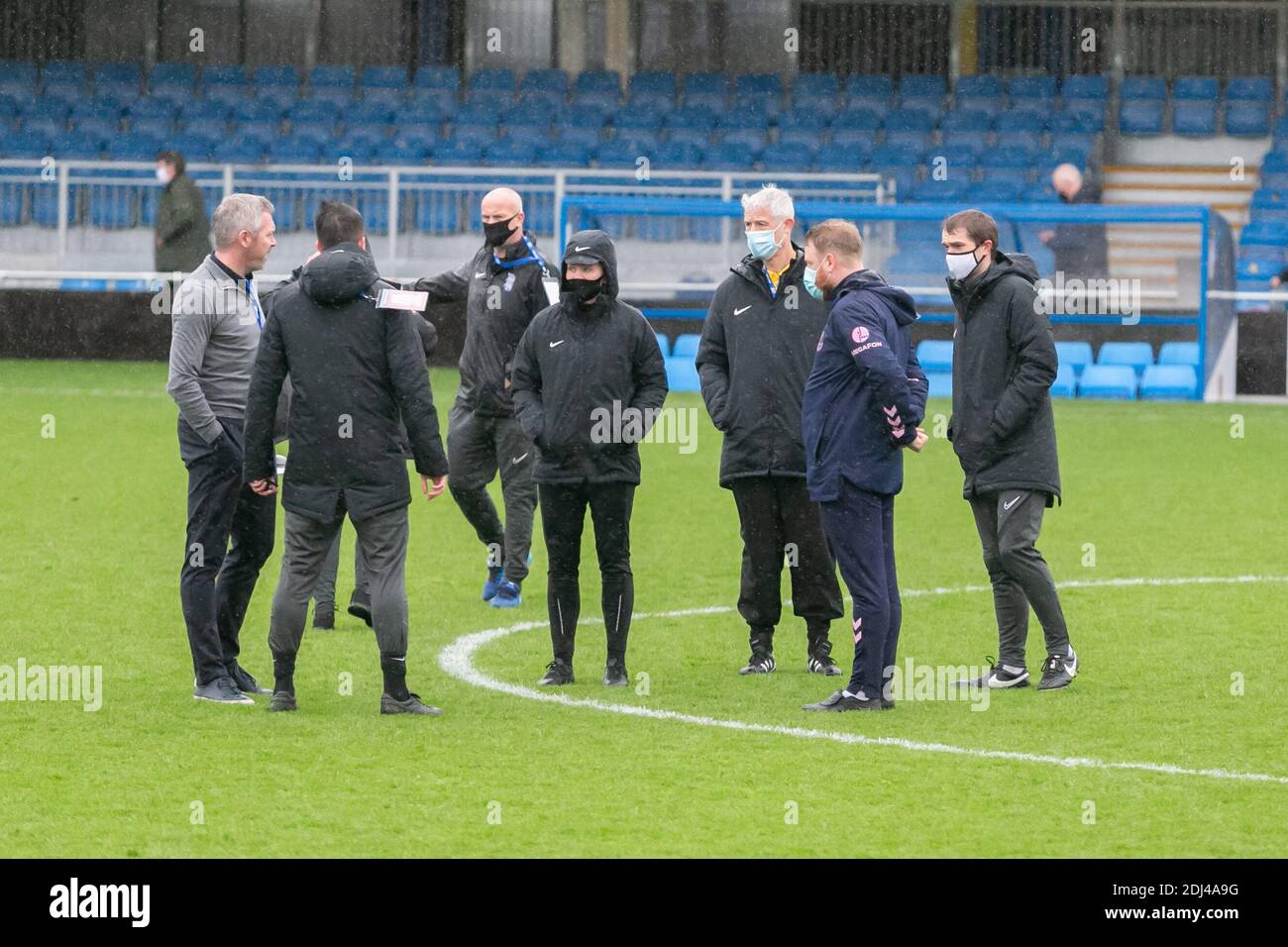 Football pitch inspection on a rainy day, UK Stock Photo