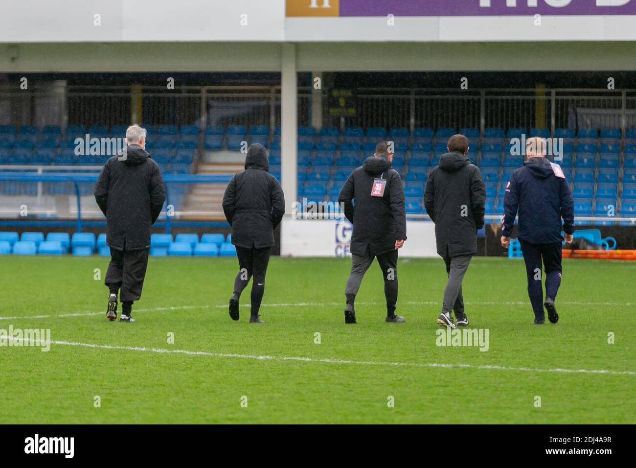 Football pitch inspection on a rainy day, UK Stock Photo