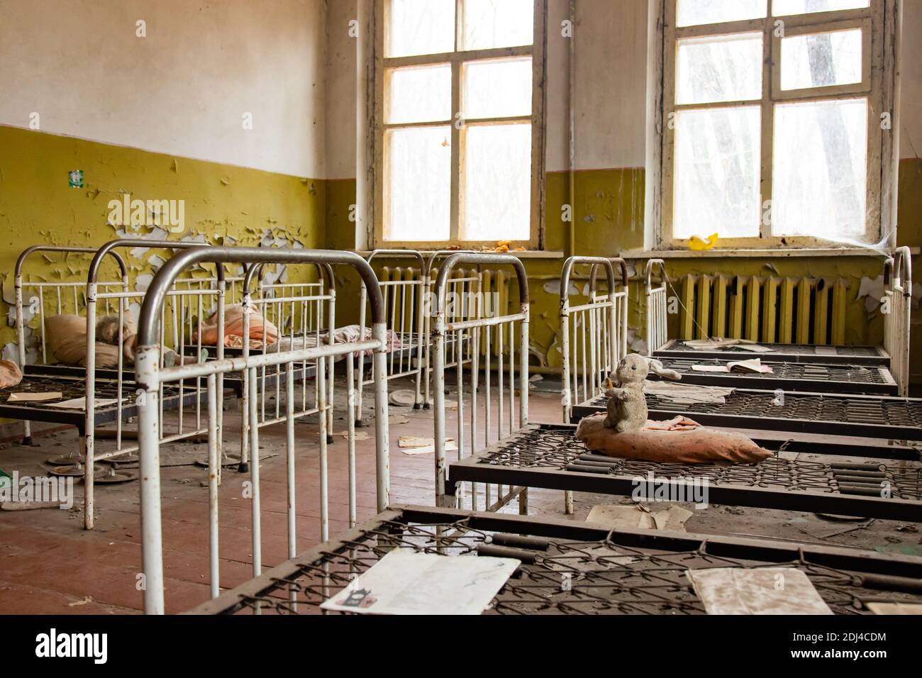 Scary dolls on beds in the kindergarten, a structure for children and a famous abandoned site in