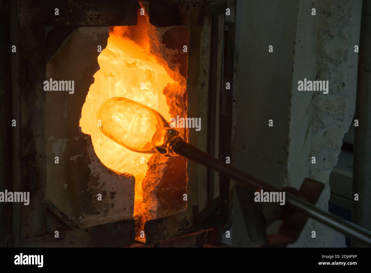 Glassmaker's the glass is in the oven to melt before forming