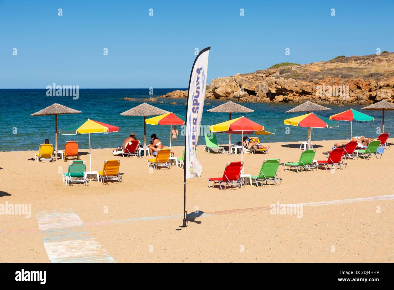 Sun loungers and umbrellas at Iguana Beach (Agii Apostoli Beach), Chania, Crete, Greece Stock Photo