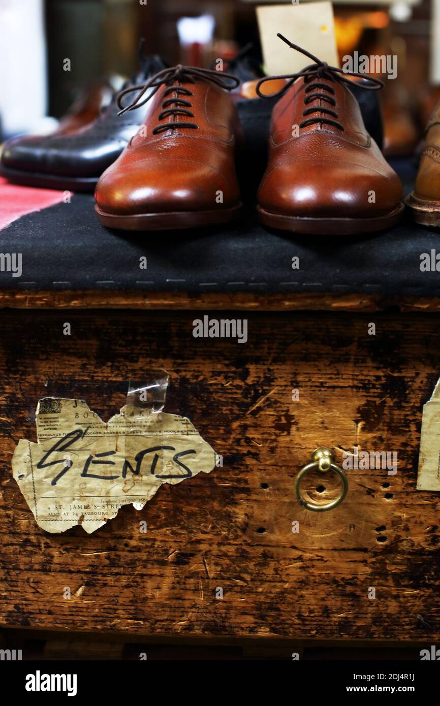 Pair of handmade brown leather shoes at John Lobb/ Makers of bespoke boots and shoes in St James London , United Kingdom Stock Photo