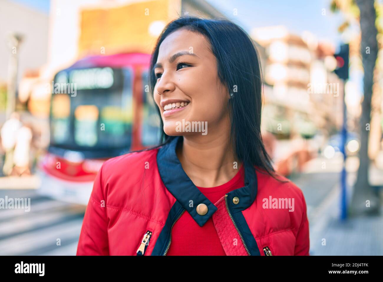 Young latin woman smiling happy walking at the city Stock Photo - Alamy