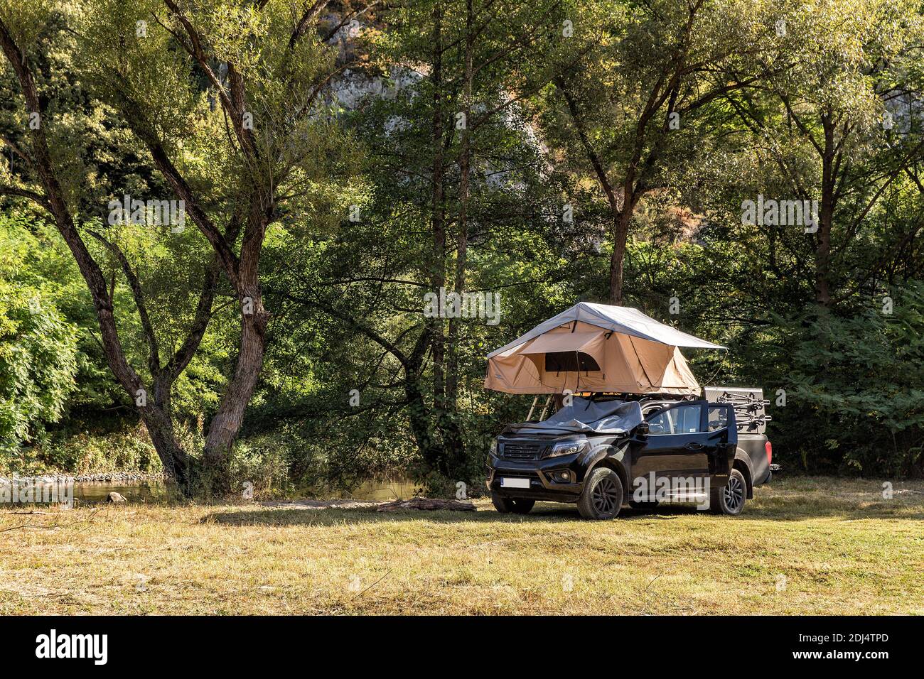 Travel by car with a roof tent. Wild camping in Romania Stock Photo - Alamy