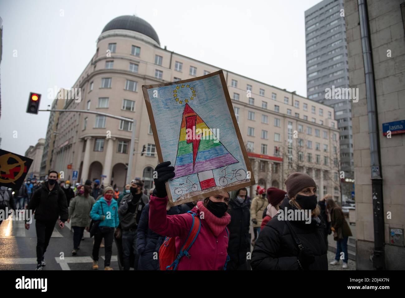 Warsaw, Warsaw, Poland. 13th Dec, 2020. A demonstrator holds a sign during an anti-government protest on December 13, 2020 in Warsaw, Poland. Several thousands of people took to the streets of Warsaw in the ongoing protest against the ruling of Poland's top court that would impose a near total ban on abortion. The protests organised by Strajk Kobiet (Women Strike), a group of women's rights activists, turned into anti government protests gathering people from different social and economic groups. On December 13 Poles also remember the introduction of martial law by the authoritarian Pol Stock Photo