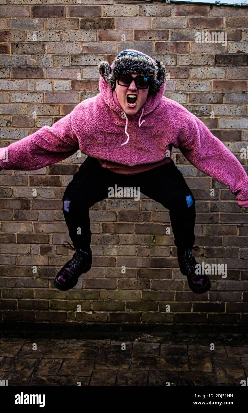 funny jumping handsome son Stock Photo Alamy
