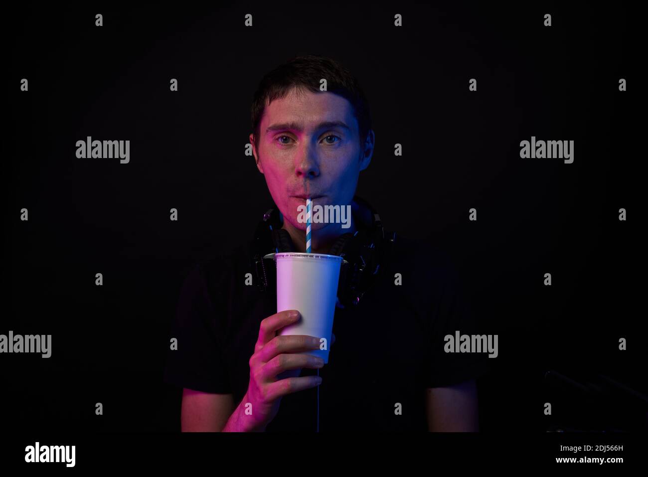 Gamer is drinking cola. Concept of virtual reality, games