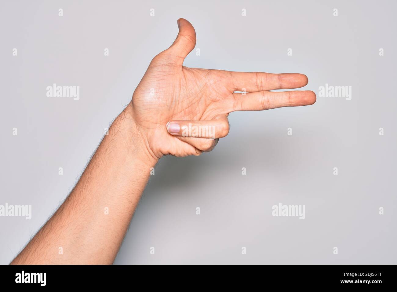 Hand of caucasian young man showing fingers over isolated white ...