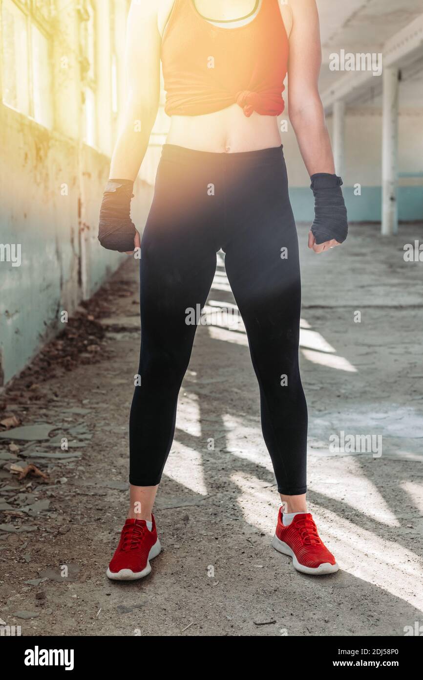 Strong, fit, female body in black leggings. Fitness fashion Stock Photo