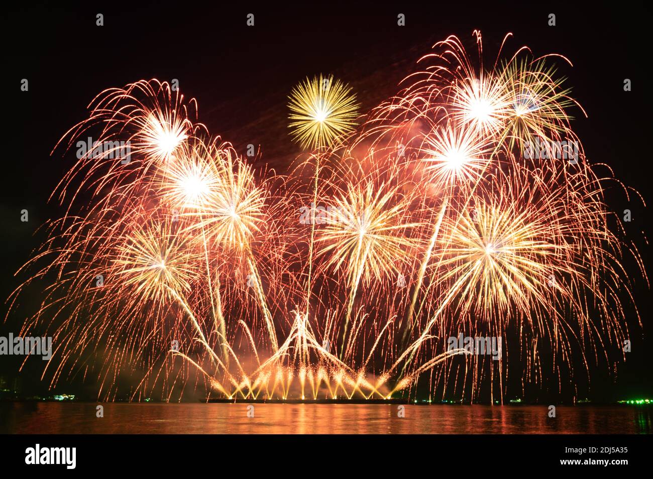 Blurred Colorful holiday fireworks in the night sky on a holiday festival night Stock Photo