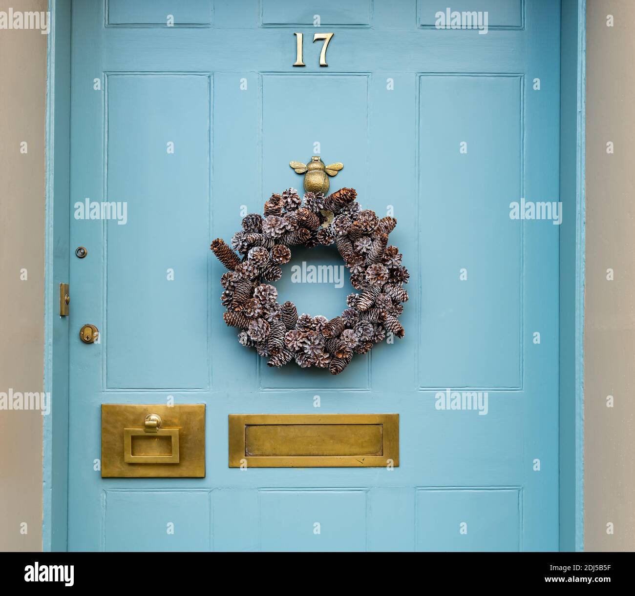Decorative Christmas wreath on front door of townhouse