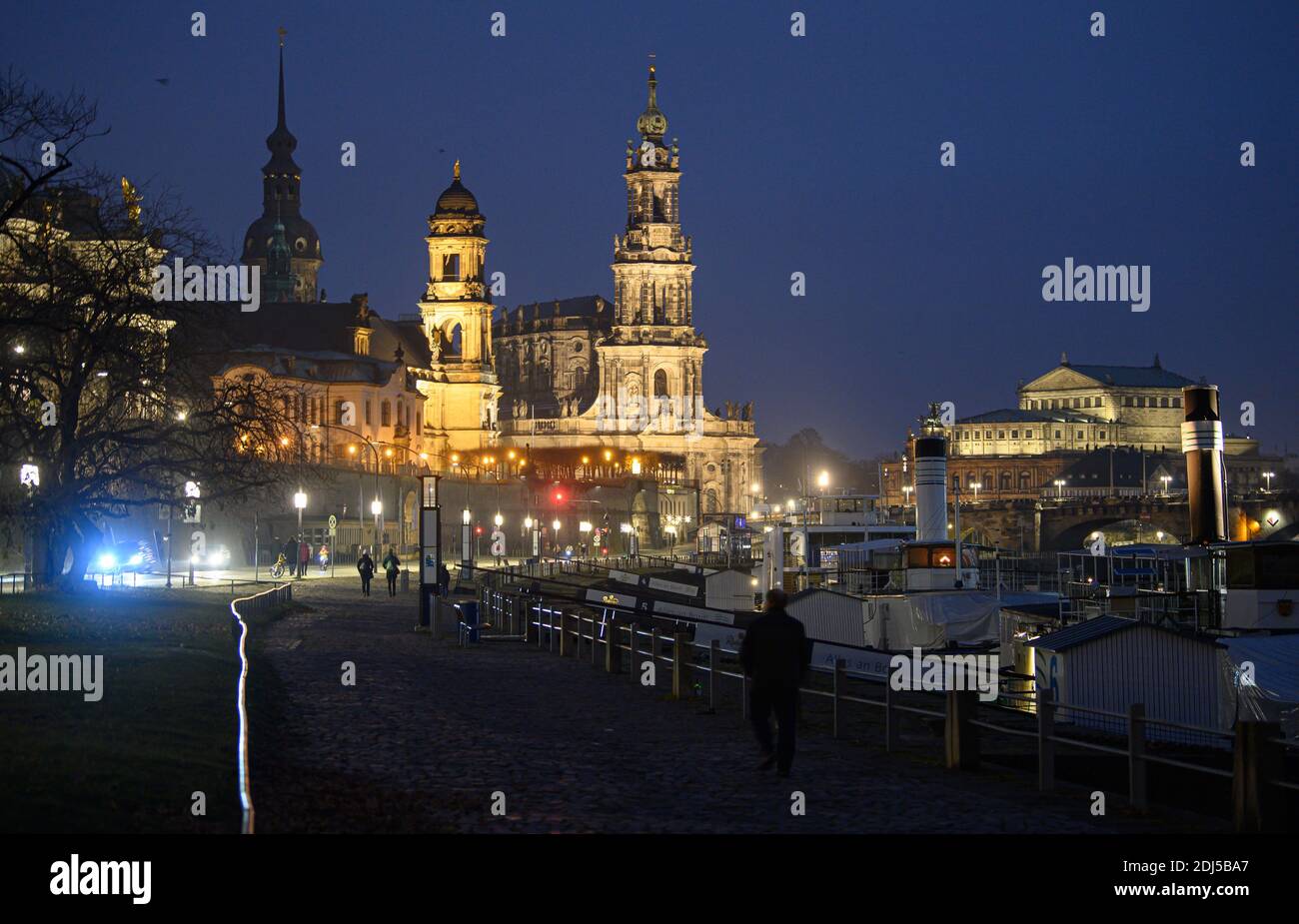 Dresden, Germany. 13th Dec, 2020. View from the terrace bank to the old town at the river Elbe with the Hausmannsturm (l-r), the Ständehaus, the court church of the Semper Opera and the steamers of the Sächsische Dampfschiffahrt. To contain the Corona pandemic, Saxony is imposing a lockdown from Monday onwards and is shutting down public life. Credit: Robert Michael/dpa-Zentralbild/dpa/Alamy Live News Stock Photo