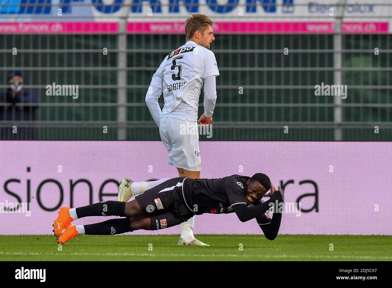 Lugano, Switzerland. 13th Dec, 2020. Lasse Sobiech (#5 Zurich) and Cristopher Lungoyi (#8 FC Lugano) in action during the Swiss Super League match between FC Lugano and FC Zürich Cristiano Mazzi/SPP Credit: SPP Sport Press Photo. /Alamy Live News Stock Photo