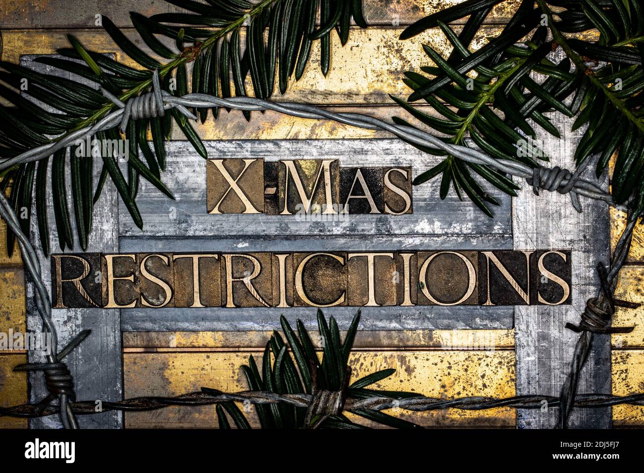X-Mas Restrictions text on vintage textured bronze grunge copper and gold background Stock Photo