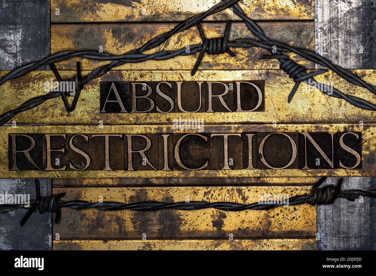 Absurd Restrictions text on vintage textured bronze grunge copper and gold background Stock Photo