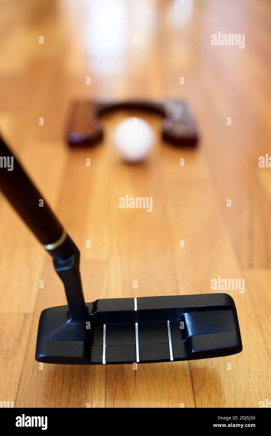 Playing mini golf at home Stock Photo