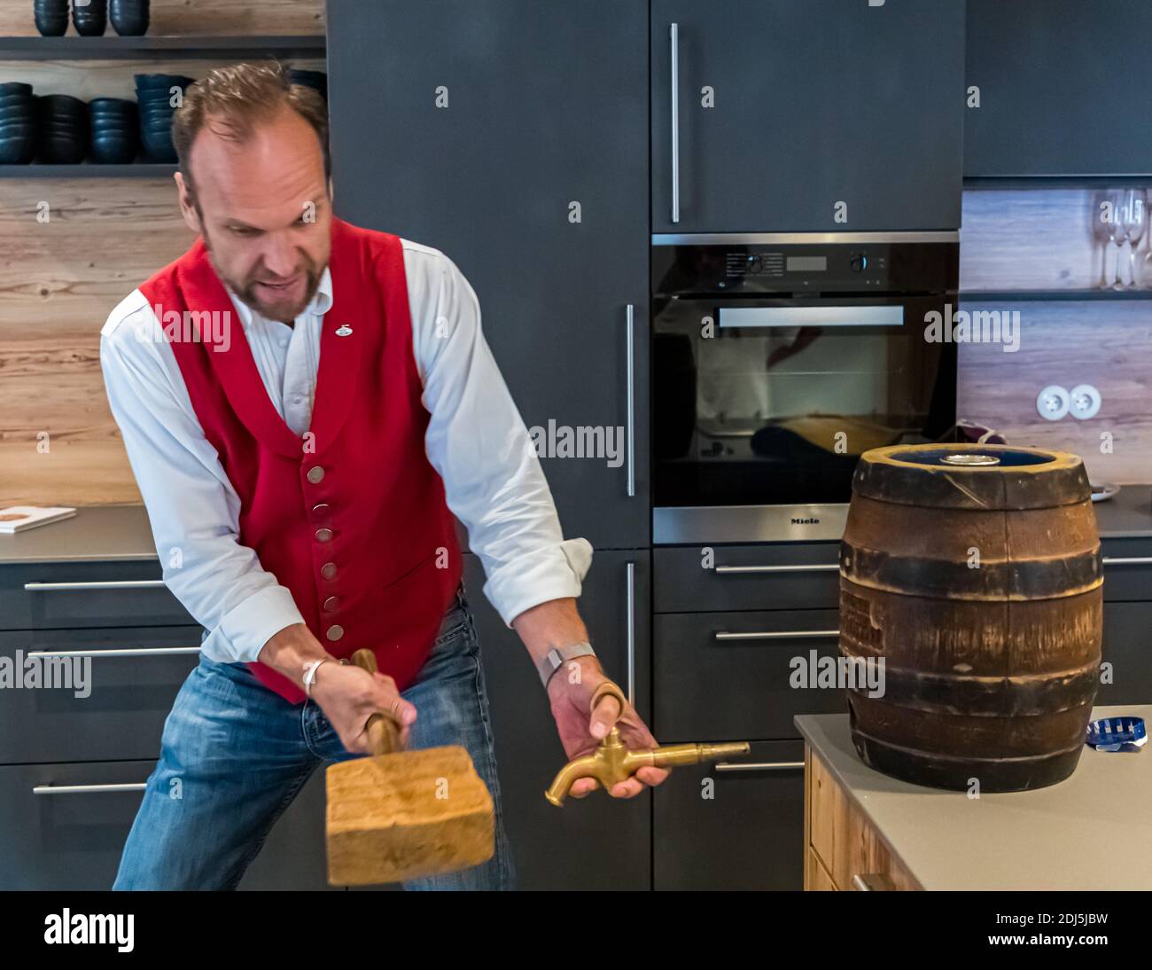 Tapping a beer keg in Kemnath-Waldeck, Germany Stock Photo